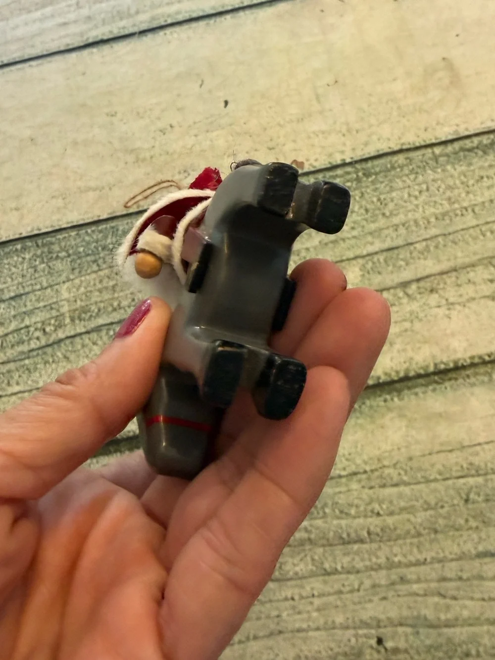 Vintage Christmas wood Santa riding a donkey horse ornament.